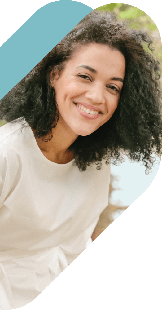 Young smiling woman with dark curly hair